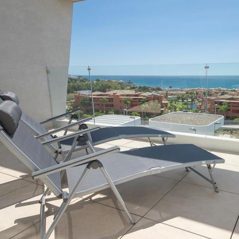 Relax and recline on your balcony while gazing out at the sea views