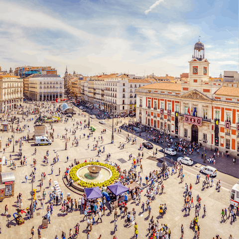 Stroll around bustling Puerta del Sol, a three-minute walk away