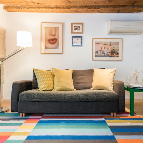 Kick back in the stylish living room with a glass of Spanish wine after a day of sightseeing