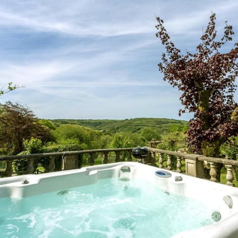 Relax in the hot tub on the terrace and drink in those views