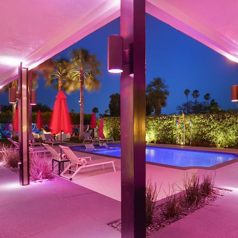 Sip a few cocktails under electric lighting on the pool terrace