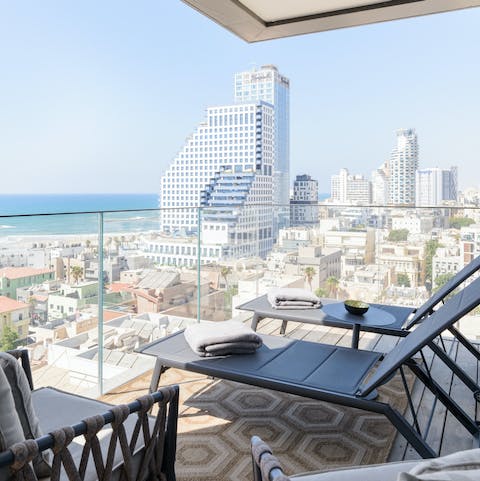 Relax on your private terrace and marvel at the stunning sea and city vistas