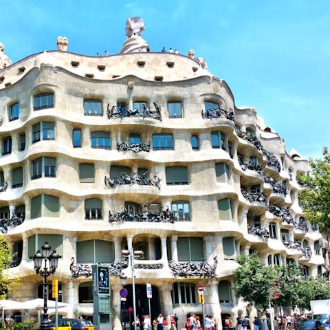 Wander through the neighbourhood to see Gaudi's majestic Casa Milà – a two–minute walk away