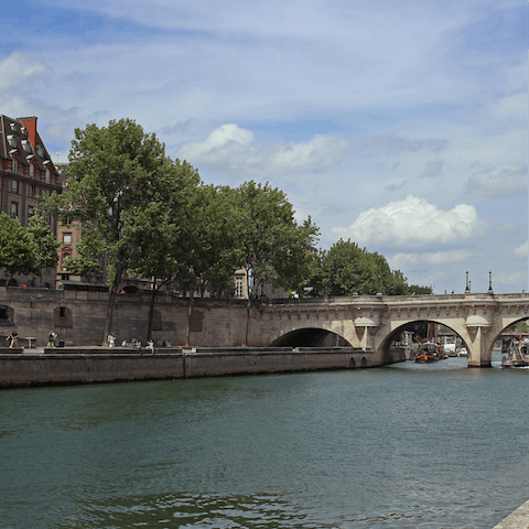 Stroll along the banks of the Seine as the sun warms your skin