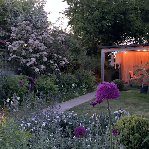 Amble along the garden path to the covered seating area for celebratory sundowners