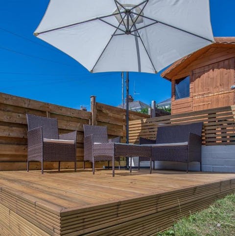 Catch some rays while sitting out on the home's raised deck