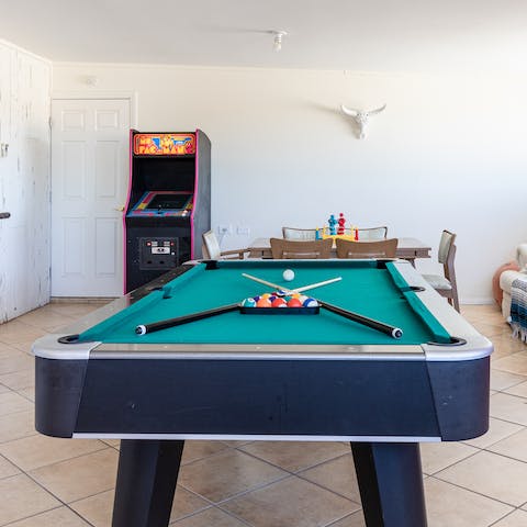 A games room with pool and Ms. Pac-Man