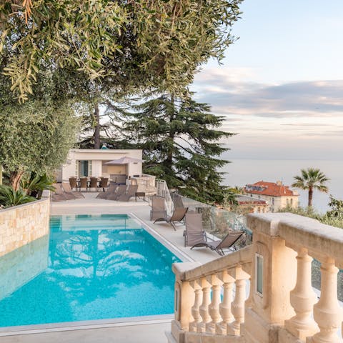 Take in the stunning Baie des Anges vistas from the pool