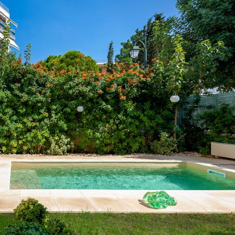 Relax in your own private oasis with an aquamarine pool at its centre