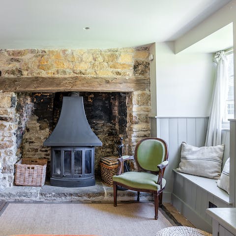 Kindle the wood-burning stove and sit down to read in the window nook