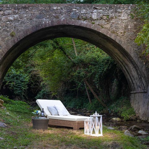 Relax on the lounger at the bottom of your garden and listen to the stream gently trickle