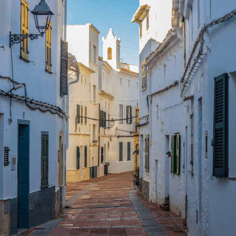 Explore the traditional streets of Es Mercadal, a short drive away