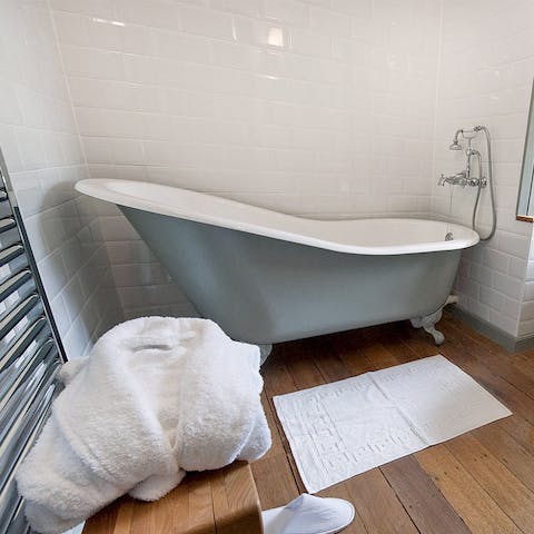 Soak in one of the luxurious roll-top baths 