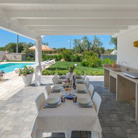 Cook up a feast with two kitchens and an alfresco dining area