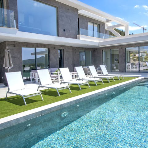 Relax by the pool or take a dip to admire the scenery