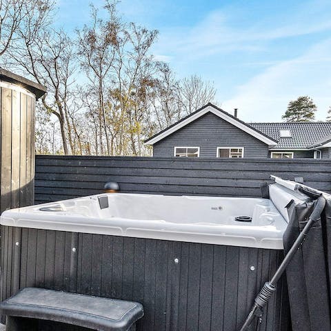 Relax in this outdoor hot tub for five 