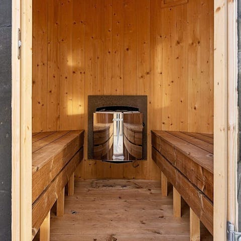 Let all the stresses evaporate in this luxurious wooden sauna 
