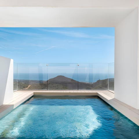 Swim in the rooftop pool and soak in the sea views