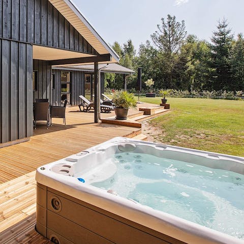 Relax in the hot tub and soak up the sunshine