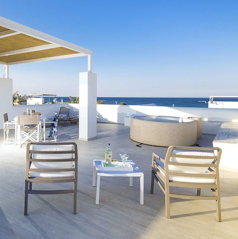 Bubble in the rooftop Jacuzzi while admiring the sea views