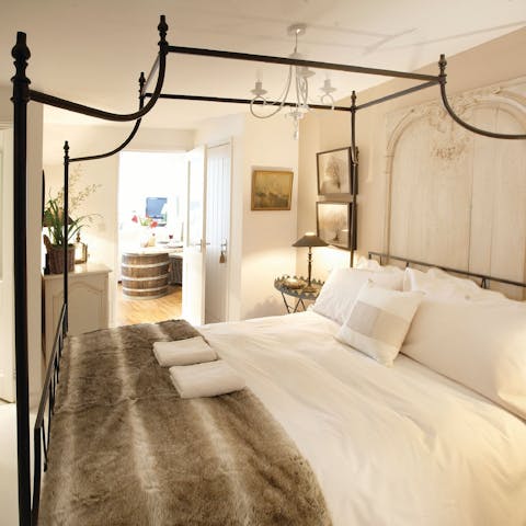 Drift off to sleep in the four-poster bed 