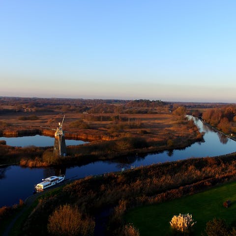 Putter down the Norfolk Broads on a chartered boat, a ten-minute drive away 