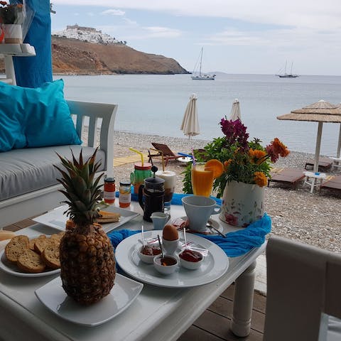 Tuck in to a buffet breakfast on the beachfront each morning