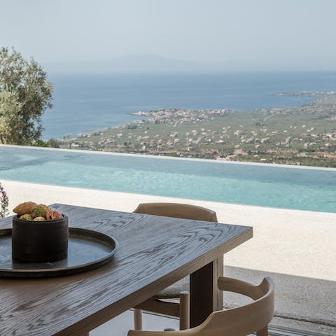 Admire views of the Messenian Gulf from the private infinity pool