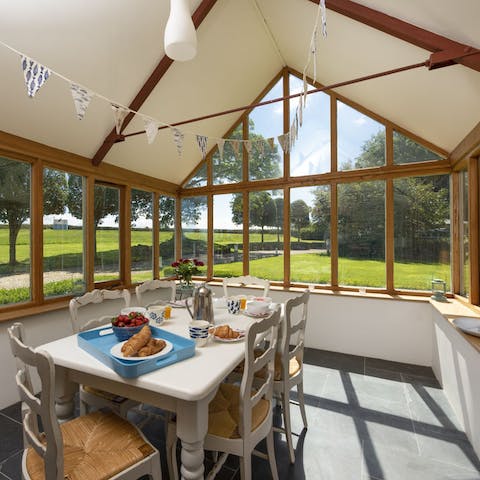 Savour breakfast overlooking the beautiful gardens