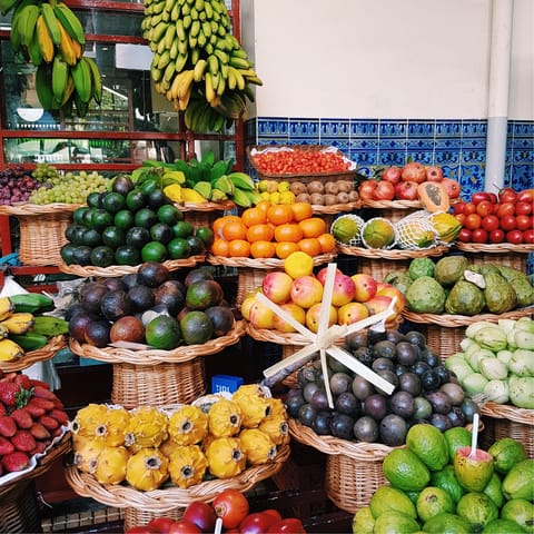 Shop for guava and other local fruits at Mercado dos Lavradores, a short walk away