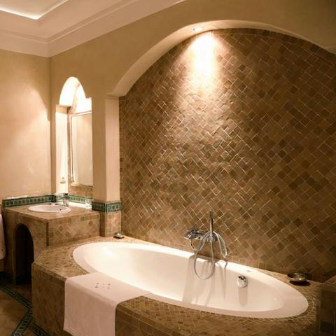 Unwind with a book and a glass of wine in the luxurious bath