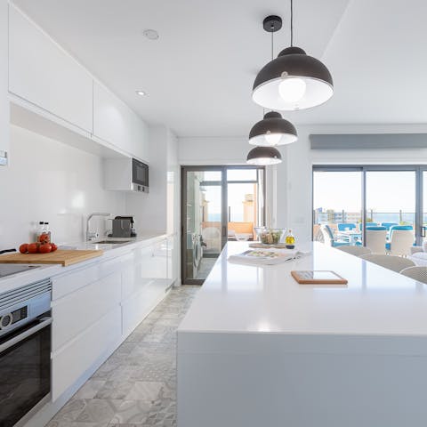Knock up a hearty breakfast in the sleek island kitchen before setting off