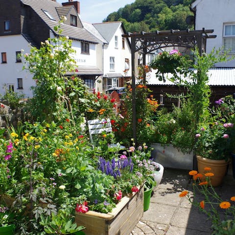 Enjoy a barbecue dinner in the flower-filled patio garden