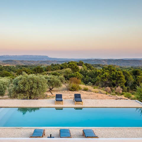 Drink in the magnificent views from beside the private heated pool