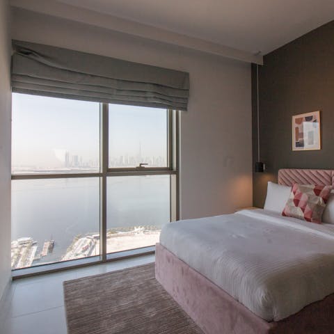 Wake up to extraordinary city views from the bedroom's huge window