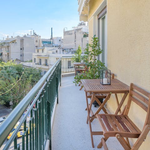 Soak up the sunshine and unwind with a glass of Greek wine on the balcony