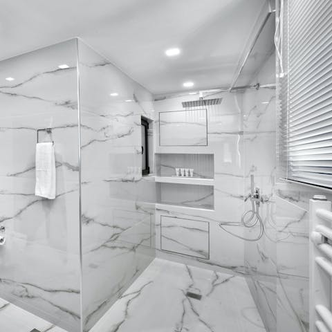 Get ready in the marble-style bathroom for a night out in Athens