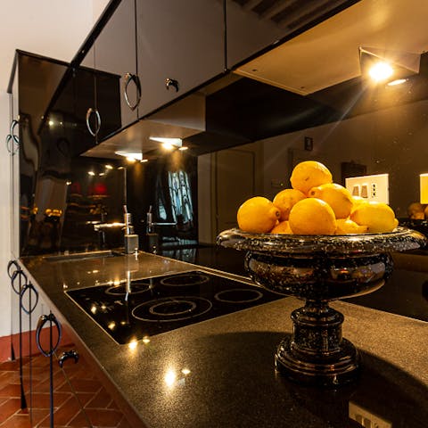 Cook up some Italian culinary delights in the sleek kitchen 
