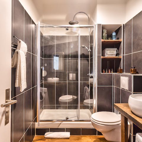 Enjoy a luxurious soak under the rainfall shower before heading out to explore