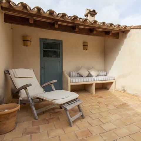 Look out from the rooftop at the enchanting village of Deia, two minutes away on foot