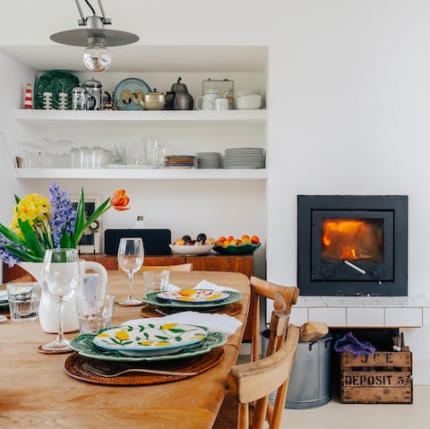 Enjoy cosy dinners by the modern woodburner 