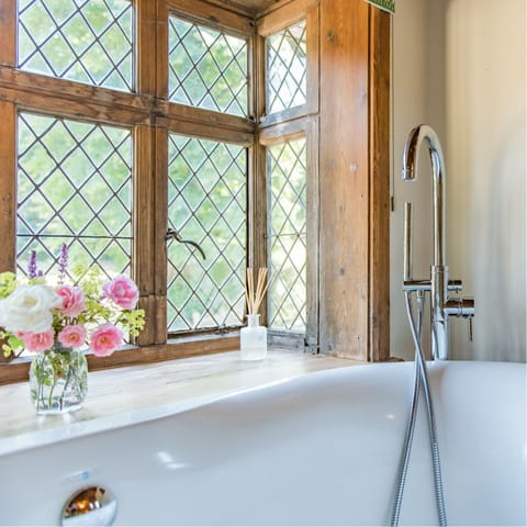 Enjoy a warm soak in the roll-top bath, as you overlook the Manor's gardens