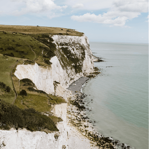 Walk to the lighthouse across the dramatic white cliff tops of Dover