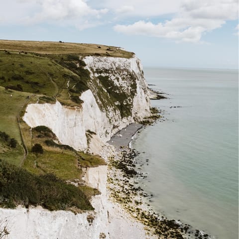 Walk to the lighthouse across the dramatic white cliff tops of Dover