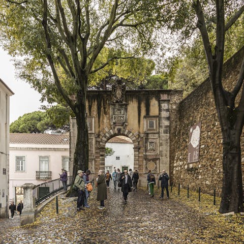 Visit São Jorge Castle, just a two-minute walk away