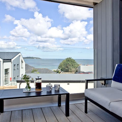 Enjoy lunch on the home's covered balcony and admire the coastal scenery