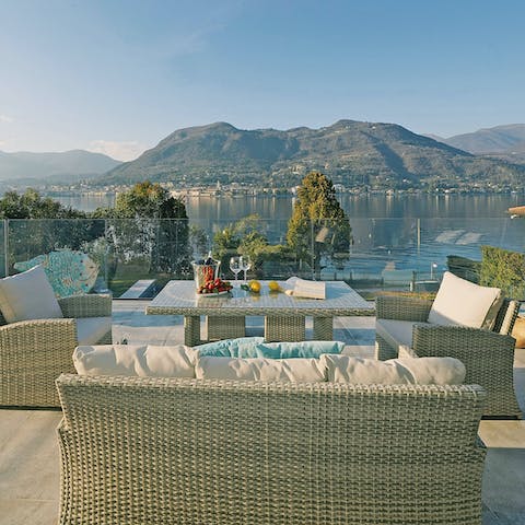 Dine alfresco as you overlook the stunning mountain and lake views