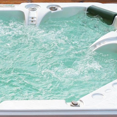 Soothe your tired muscles in the outdoor hot tub