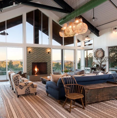 Stretch out on the sofa by the roaring fire, set against an awe-inspiring backdrop