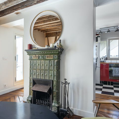 Admire the character features such as the ornate fireplace